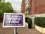 Sign in front of building. Sign reads: Private Event.