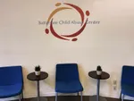 Waiting room at the BCAC with their logo on the wall.
